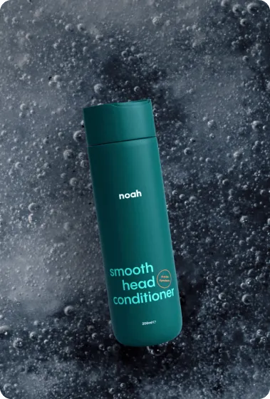 Noah Smooth Head Conditioner teal bottle on dark bubbly water background for OTC sale