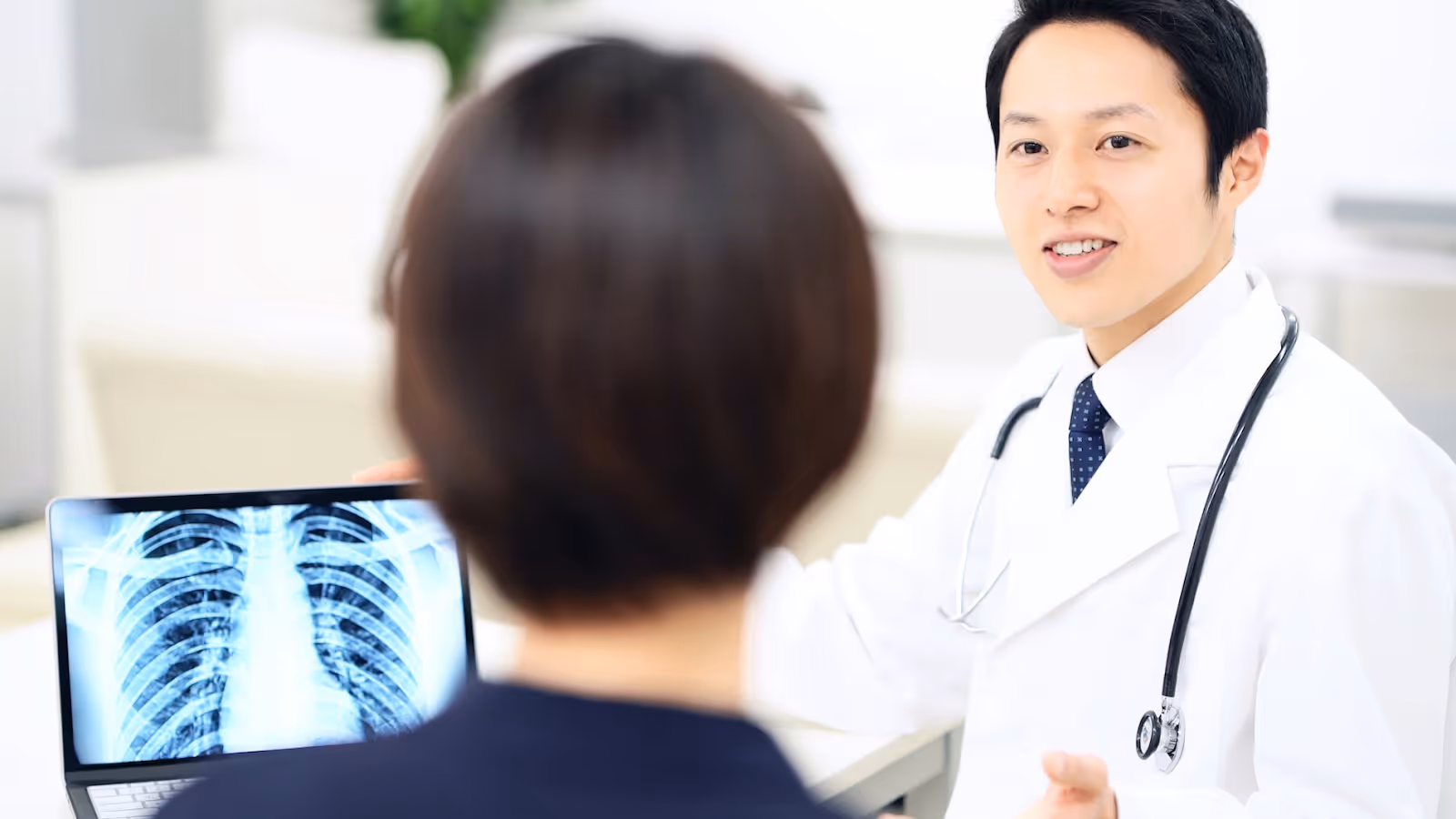 Patient consulting with his doctor at a clinic