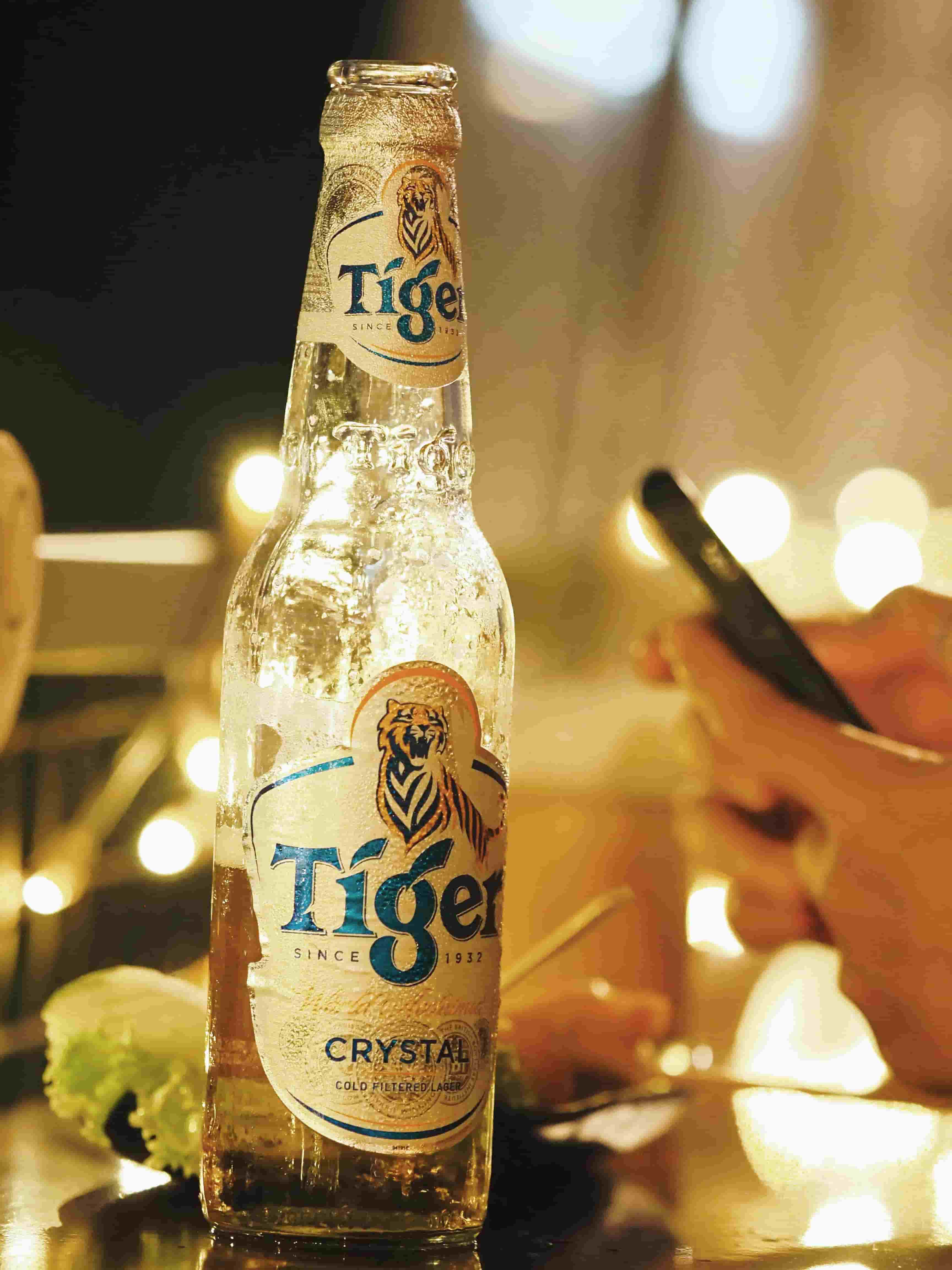 A half emptied bottle of Tiger beer