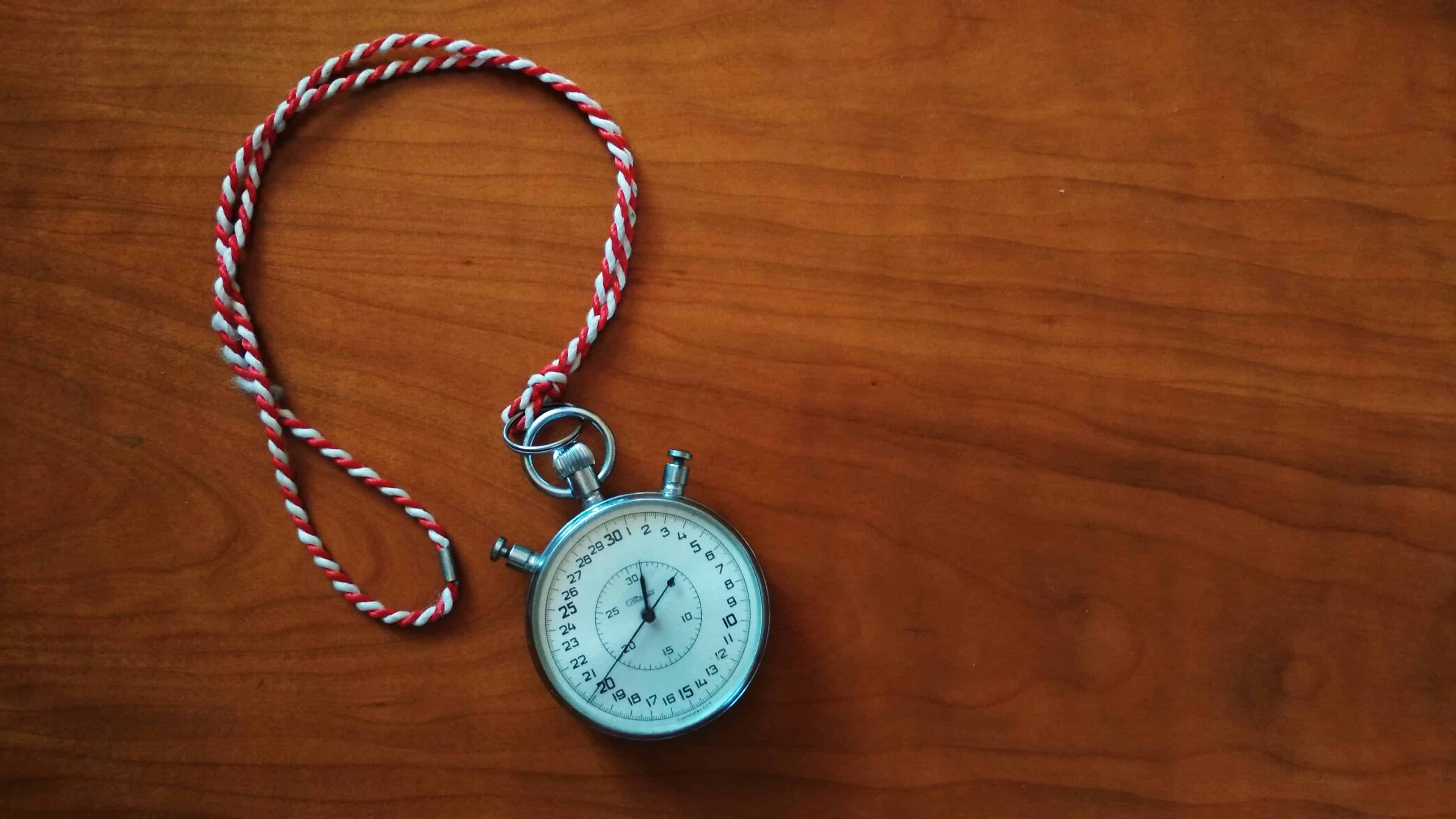 A timer on top of a wooden table