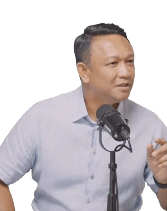 Fandi Ahmad speaking into a podcast microphone