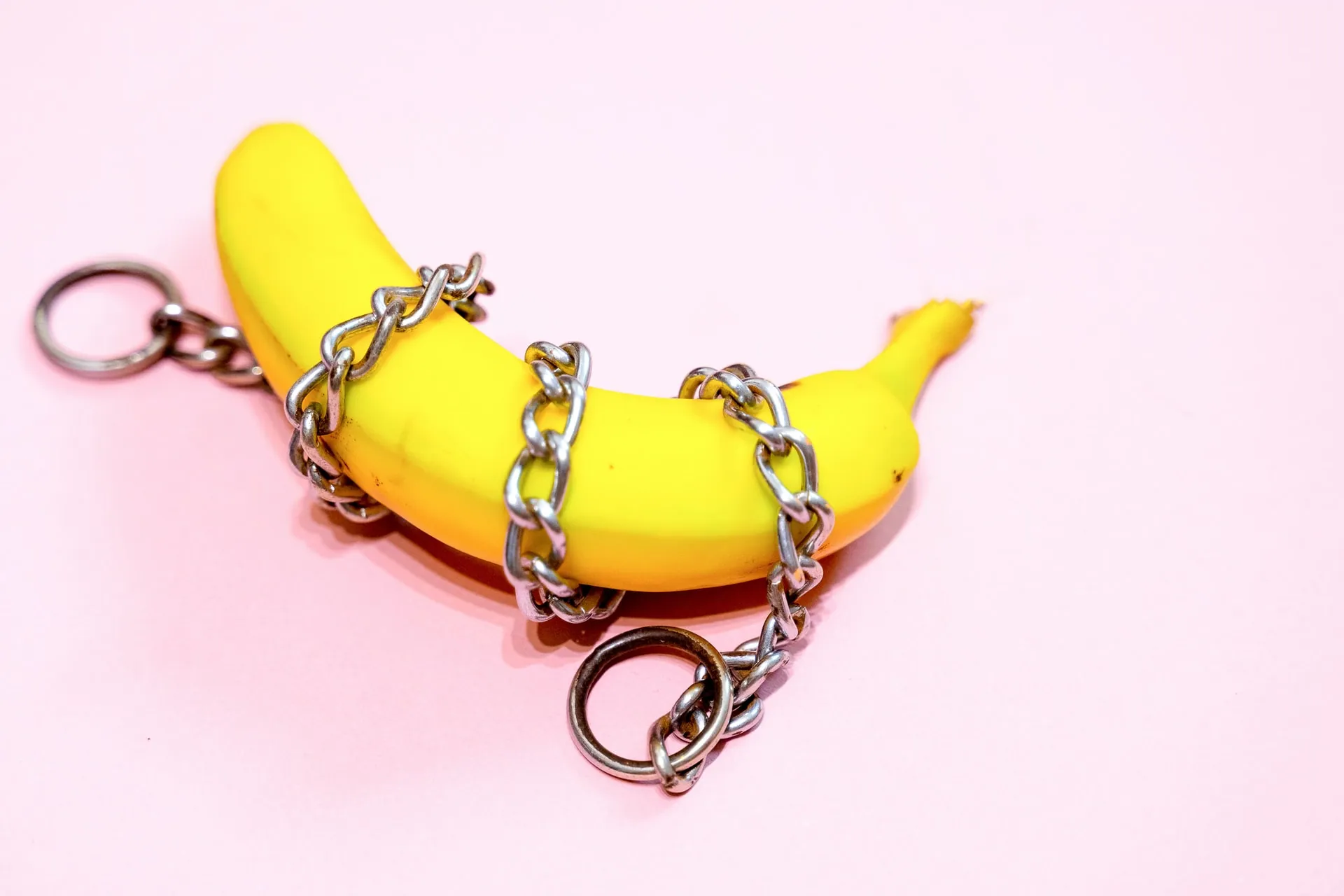 A gold chain wrapped around a banana