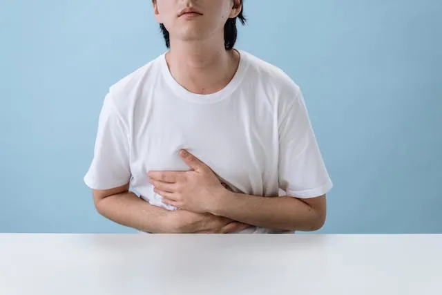 Man consulting with healthcare professional about medication side effects