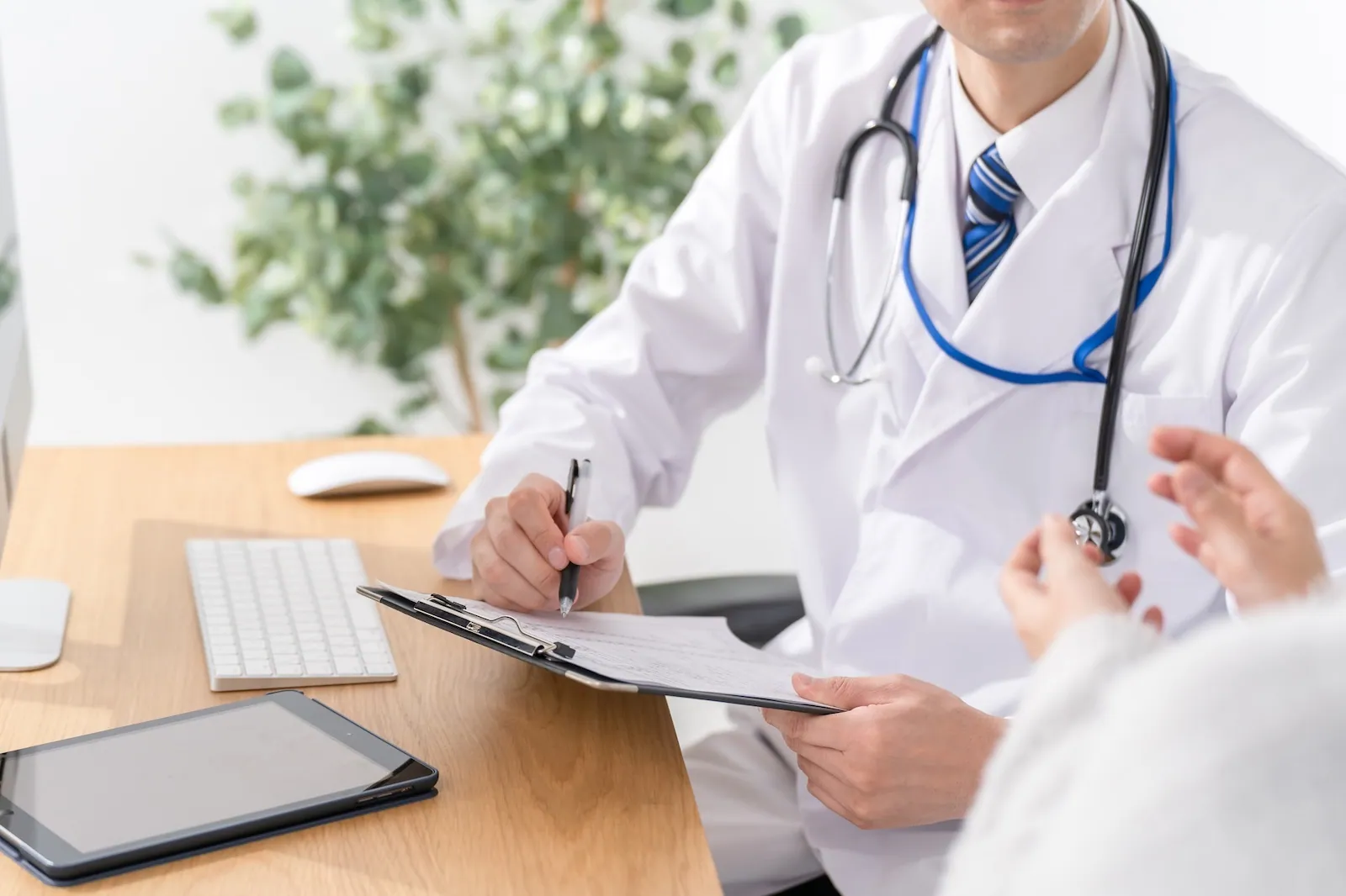 A patient consulting with a doctor